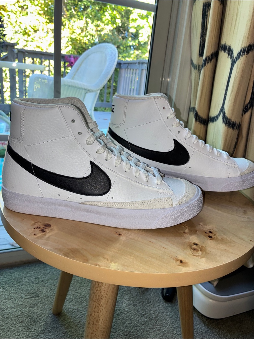 Nike White High-Top Sneakers with Black Swoosh